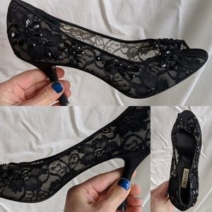 Black jeweled open toe pumps